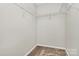 Spacious walk-in closet with carpeted floor and wire shelving for optimal storage and organization at 10032 Pergola View Ct, Charlotte, NC 28213