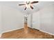 A bedroom with hardwood floors, white walls, and a view to another room at 1156 Westover Cir, Rock Hill, SC 29732