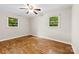 Sunny bedroom features hardwood floors, a ceiling fan, and lots of light from two windows at 1156 Westover Cir, Rock Hill, SC 29732