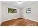 A bedroom featuring hardwood floors and natural light streaming through windows at 1156 Westover Cir, Rock Hill, SC 29732