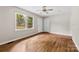 Sun-lit bedroom with hardwood floors, ceiling fan, and access to the backyard at 1156 Westover Cir, Rock Hill, SC 29732