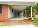 Spacious carport featuring brick and painted supports, offering ample covered parking at 1156 Westover Cir, Rock Hill, SC 29732