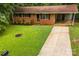 Quaint red-brick home with a covered carport and a front yard at 1156 Westover Cir, Rock Hill, SC 29732