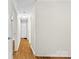 Hallway featuring hardwood floors and doors leading to other rooms in the home at 1156 Westover Cir, Rock Hill, SC 29732