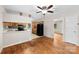 Open-concept kitchen and dining area with hardwood floors and ample cabinet space at 1156 Westover Cir, Rock Hill, SC 29732