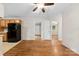 An open-concept living room showcasing hardwood floors and seamless flow into the adjacent dining and kitchen areas at 1156 Westover Cir, Rock Hill, SC 29732