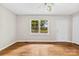 A living room featuring hardwood floors and natural light streaming through windows at 1156 Westover Cir, Rock Hill, SC 29732