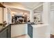 Stylish bar area with granite countertop, dark blue cabinetry, and a pass-through to the adjacent living area at 1175 18Th Ne Ave, Hickory, NC 28601