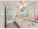 Long bathroom with granite countertop and dual closets at 1175 18Th Ne Ave, Hickory, NC 28601