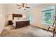 Sunlit bedroom featuring a large bed, neutral walls, and two windows at 1175 18Th Ne Ave, Hickory, NC 28601