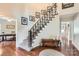 Inviting foyer featuring a staircase with an ornate iron railing and gleaming hardwood floors at 1175 18Th Ne Ave, Hickory, NC 28601