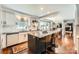 Bright, open kitchen featuring white cabinets, granite countertops, and a large center island with seating at 1175 18Th Ne Ave, Hickory, NC 28601