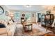 Cozy living room featuring hardwood floors, a stylish rug, and natural light from two large windows at 1175 18Th Ne Ave, Hickory, NC 28601