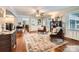 Bright living room with an open layout, elegant rug, and view of the kitchen at 1175 18Th Ne Ave, Hickory, NC 28601