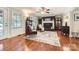 Inviting living room featuring a cozy fireplace, hardwood floors, and stylish armchairs at 1175 18Th Ne Ave, Hickory, NC 28601