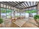Sun room with two rocking chairs, a ceiling fan, and walls of windows at 1175 18Th Ne Ave, Hickory, NC 28601
