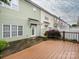 Wood deck offers space for relaxation with views of the home's tidy, fenced yard and rear windows at 13604 Morehouse St, Huntersville, NC 28078