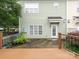 Wood deck overlooks the yard in back of the home, showcasing the AC unit next to the back door at 13604 Morehouse St, Huntersville, NC 28078