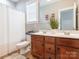 Bathroom with a double sink vanity, with a shower and tub combination, and a large mirror to enhance functionality at 13604 Morehouse St, Huntersville, NC 28078