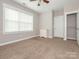 Bedroom with soft carpet, features a window and closet creating a cozy and functional living space at 13604 Morehouse St, Huntersville, NC 28078