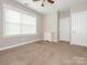 Bedroom with soft carpet, features a window and closet creating a cozy and functional living space at 13604 Morehouse St, Huntersville, NC 28078