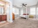 Inviting bedroom featuring a four-poster bed and ensuite bathroom access at 13604 Morehouse St, Huntersville, NC 28078