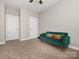 Bedroom features soft carpet, natural light, and closet creating a cozy and functional living space at 13604 Morehouse St, Huntersville, NC 28078