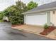 Attached one car garage with driveway and manicured landscaping enhancing curb appeal at 13604 Morehouse St, Huntersville, NC 28078