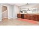 Open kitchen layout featuring wood cabinets and a convenient breakfast bar area at 13604 Morehouse St, Huntersville, NC 28078