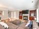 Spacious living room featuring a fireplace, built-ins, and comfortable sectional sofa at 13604 Morehouse St, Huntersville, NC 28078