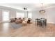 Open living room with view to dining area showcasing stylish furniture at 13604 Morehouse St, Huntersville, NC 28078