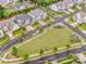 Aerial view showcasing the neighborhood with well-maintained streets, green spaces, and neatly arranged houses at 13708 Huntson Park Ln, Huntersville, NC 28078
