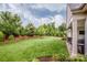 Expansive backyard featuring lush green lawn, privacy fence, and mature trees providing a serene outdoor space at 13708 Huntson Park Ln, Huntersville, NC 28078