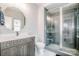 A modern bathroom offers a glass-enclosed shower and vanity with a vessel sink at 13708 Huntson Park Ln, Huntersville, NC 28078