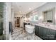 A spacious bathroom with a soaking tub, double vanity, walk-in shower and tile floor at 13708 Huntson Park Ln, Huntersville, NC 28078