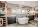 A luxurious bathroom with a soaking tub, double vanity, walk-in shower and tile floor at 13708 Huntson Park Ln, Huntersville, NC 28078