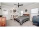 Relax in this bedroom featuring neutral tones, modern accents, and a ceiling fan at 13708 Huntson Park Ln, Huntersville, NC 28078