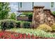Stone community sign for Huntson Reserve with beautiful landscaping and inviting design at 13708 Huntson Park Ln, Huntersville, NC 28078