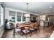 Spacious dining room with large windows providing ample natural light and a view to the outdoors at 13708 Huntson Park Ln, Huntersville, NC 28078