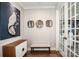 Stylish foyer featuring hardwood floors, elegant decor, and a glass-paned door leading to another room at 13708 Huntson Park Ln, Huntersville, NC 28078