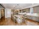 Modern kitchen with a large island, barstool seating, and stainless steel appliances at 13708 Huntson Park Ln, Huntersville, NC 28078