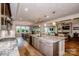 Open kitchen with a large island, modern appliances, and a view to the living area at 13708 Huntson Park Ln, Huntersville, NC 28078
