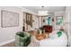 Cozy living room with stylish seating, piano, and view to the staircase at 13708 Huntson Park Ln, Huntersville, NC 28078