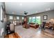 Inviting living room with large windows, cozy seating, and ample space for relaxation and entertainment at 13708 Huntson Park Ln, Huntersville, NC 28078