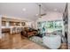 Open concept living room with backyard access, connected to a spacious kitchen area at 13708 Huntson Park Ln, Huntersville, NC 28078