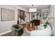 Charming living room featuring plush seating, artistic decor, and a seamless blend of modern design at 13708 Huntson Park Ln, Huntersville, NC 28078