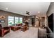 Comfortable living room featuring plush seating, natural light, and a welcoming atmosphere at 13708 Huntson Park Ln, Huntersville, NC 28078