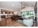 Open-concept living area flows to the kitchen and offers access to outdoor spaces at 13708 Huntson Park Ln, Huntersville, NC 28078