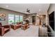 A cozy living room featuring neutral decor, comfortable seating, and natural light at 13708 Huntson Park Ln, Huntersville, NC 28078