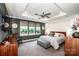 Cozy main bedroom with natural light, tray ceiling and carpeted floors creating a relaxing retreat at 13708 Huntson Park Ln, Huntersville, NC 28078